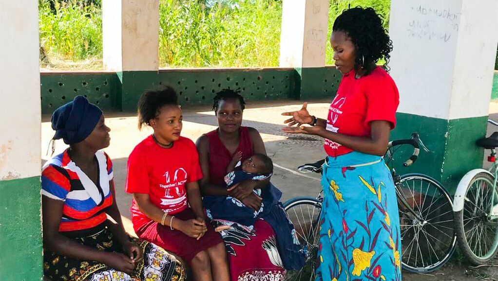 Outreach Volunteer teaching Malawians about HIV