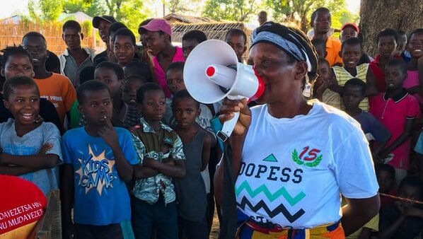 villagers educating their community on HIV