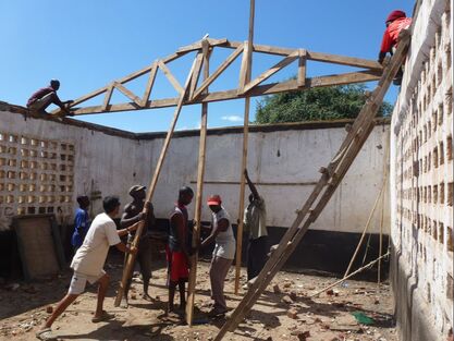 building a roof on a Malawian school