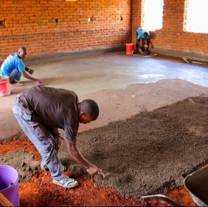building a classroom floor in malawi