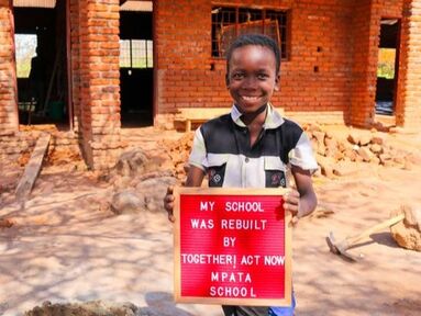 a happy student in Malawi